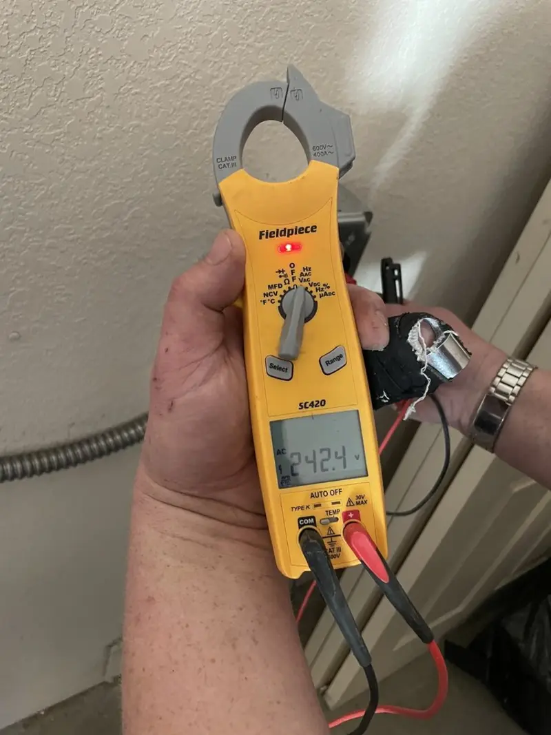 Voltage testing with clamp meter during Recessed Lighting Installation in Mansfield